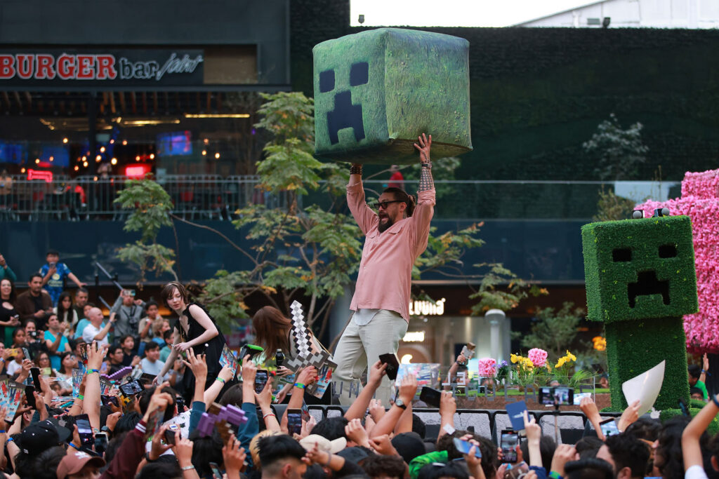 Minecraft fan event with performers and Creeper-themed props from Xbox XP announcement